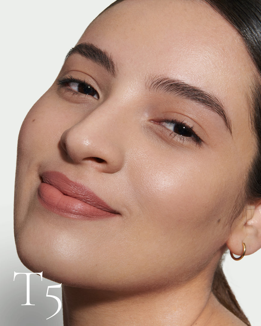 numbered howtouse Close up portrait of model wearing T5 with text displaying so