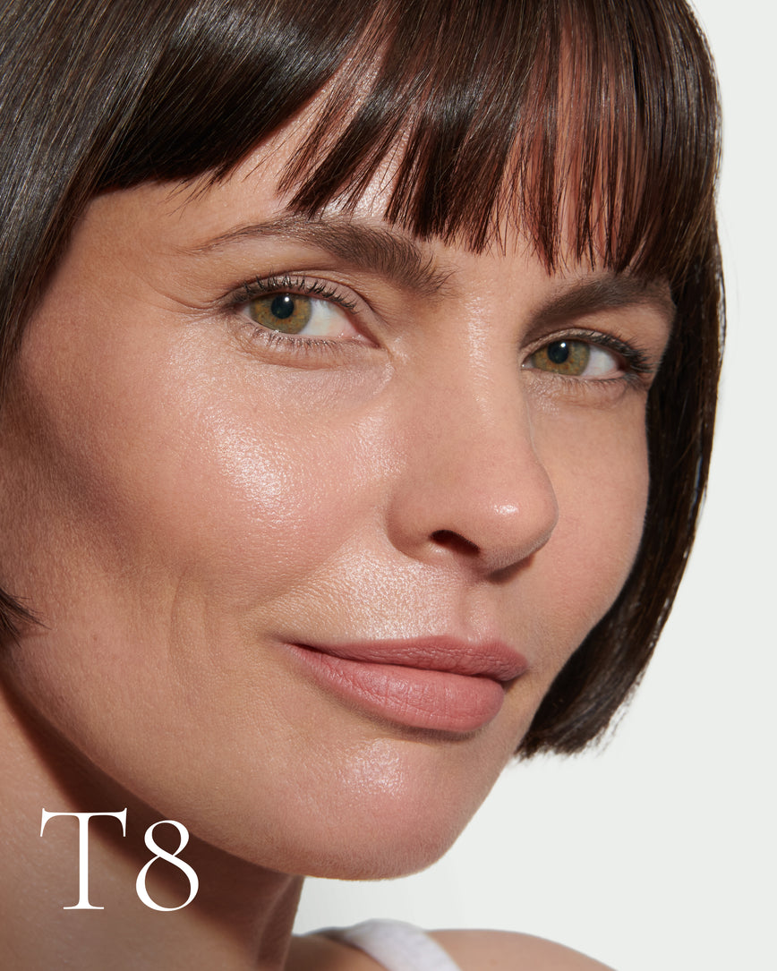 numbered Close up portrait of model wearing T8 with text displaying so